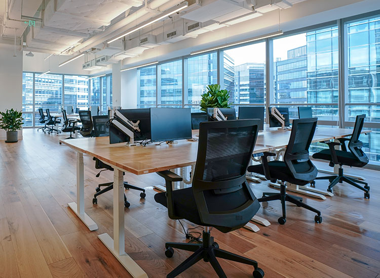 A large open office space with newly installed office furniture.